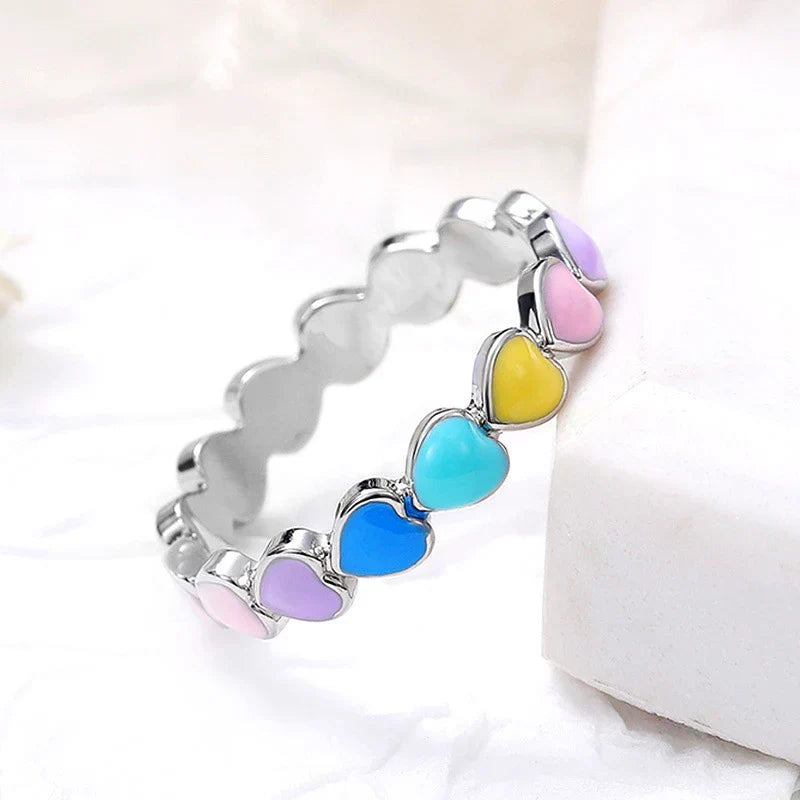 Vibrant rainbow hearts ring