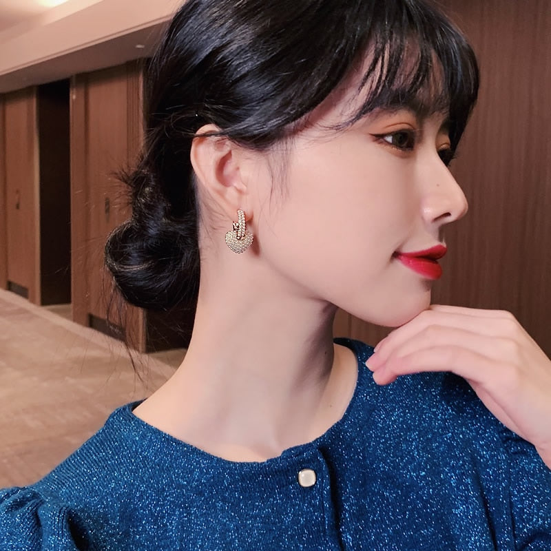 Radiant pearl love earrings
