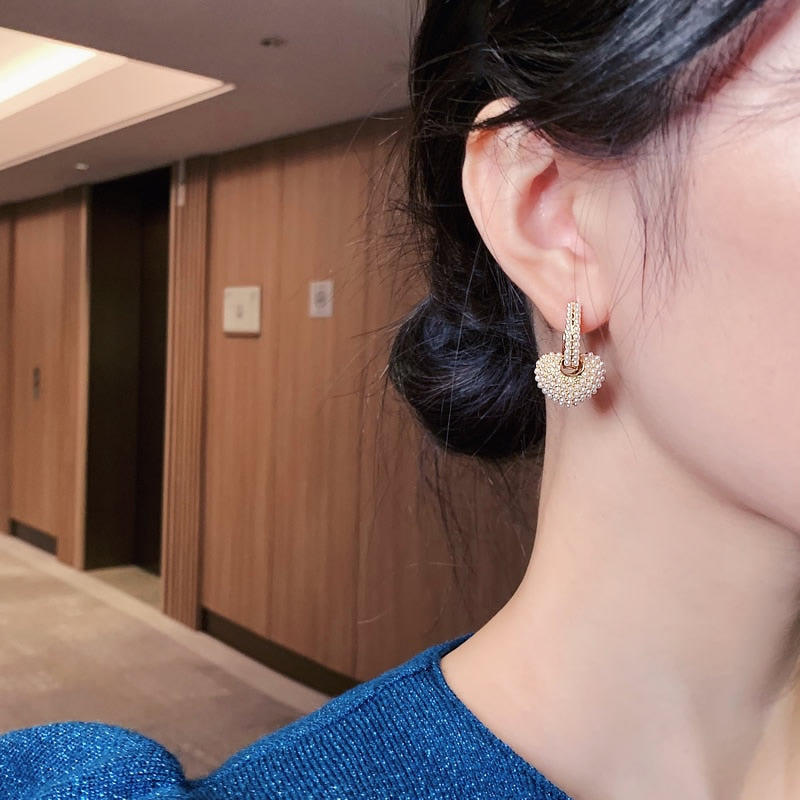 Radiant pearl love earrings
