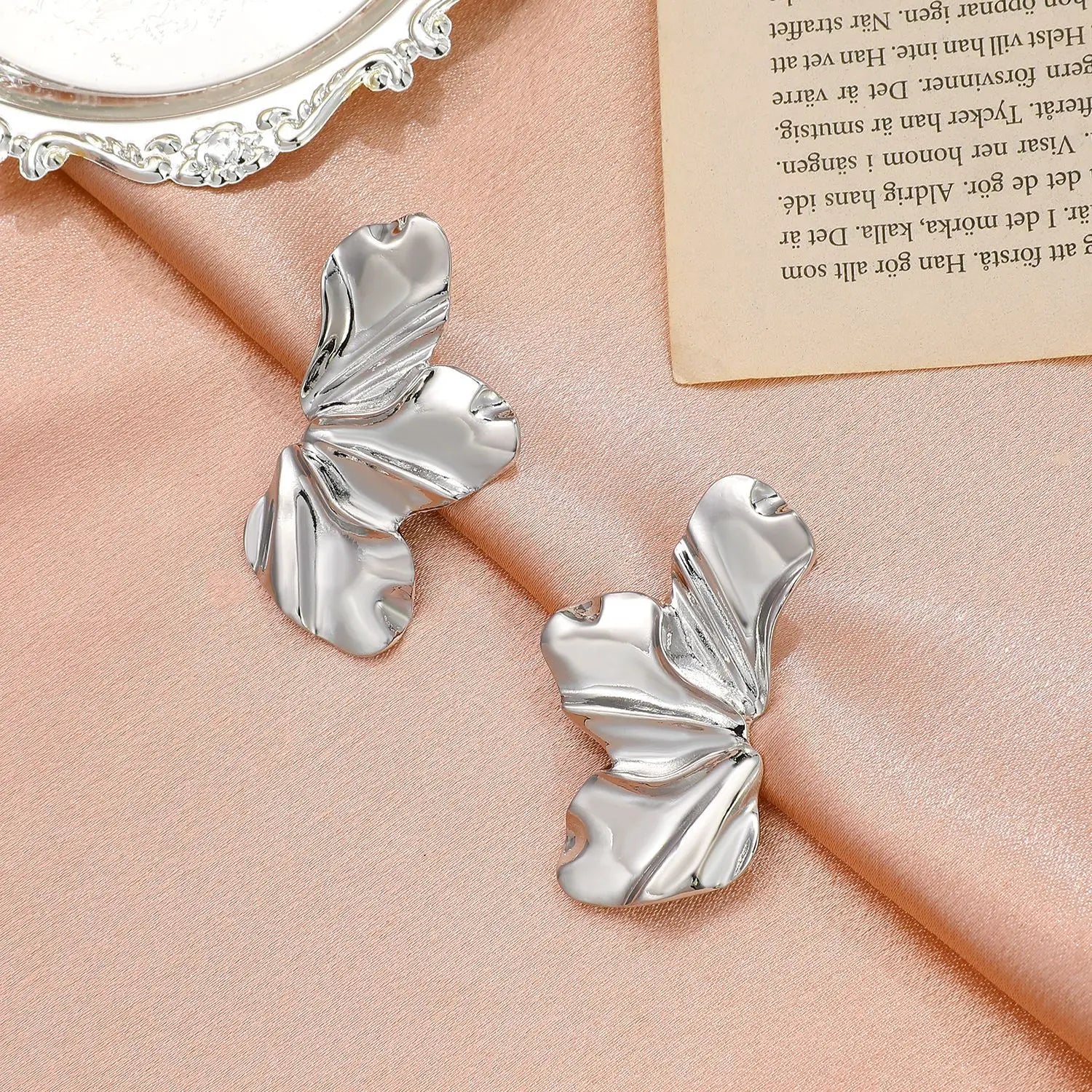 Women's metallic flower-shaped statement earrings