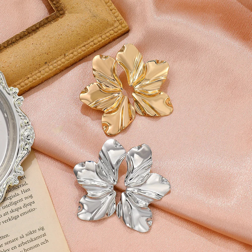 Women's metallic flower-shaped statement earrings