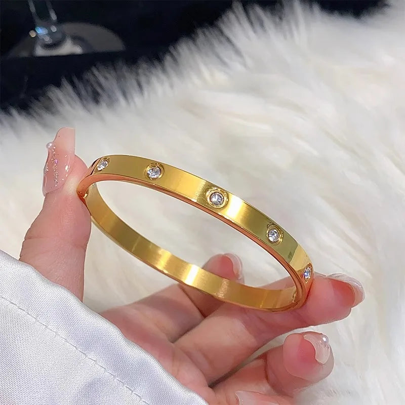 Lorenza - titanium gold-plated wide ten diamond bangle
